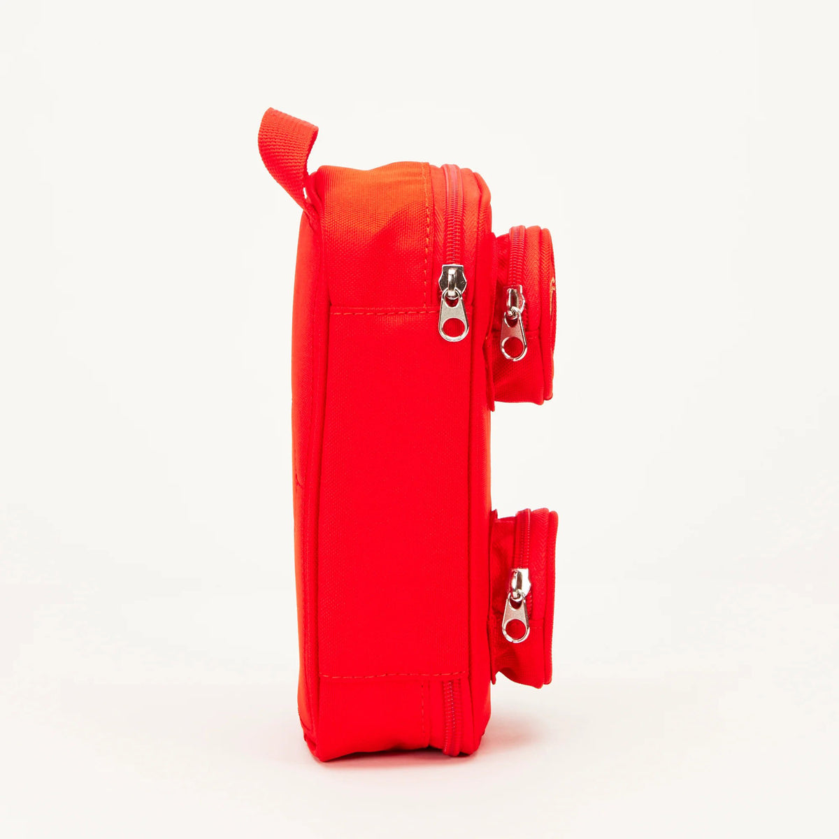 Side profile of a red LEGO® Brick Simple Pouch - ONLINE ONLY with two small circular zippered front compartments.