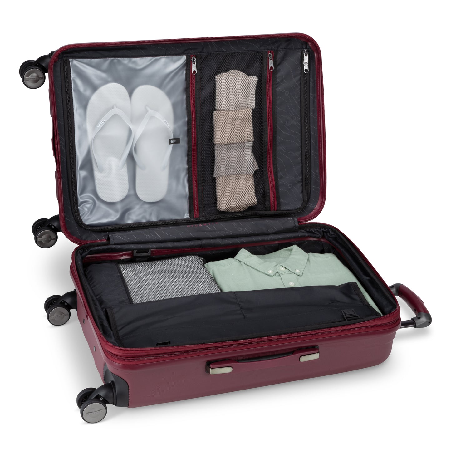 Atlantic Propeller 24″ Spinner suitcase, maroon, open to show neat clothes, flip-flops & socks in cubes.