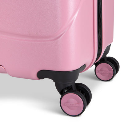 Close up of black and pink spinner wheels on blush Atlantic Transmarine 24" Expandable Spinner