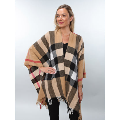 Woman wearing Alina's Plaid Cape in beige with one hand on hip