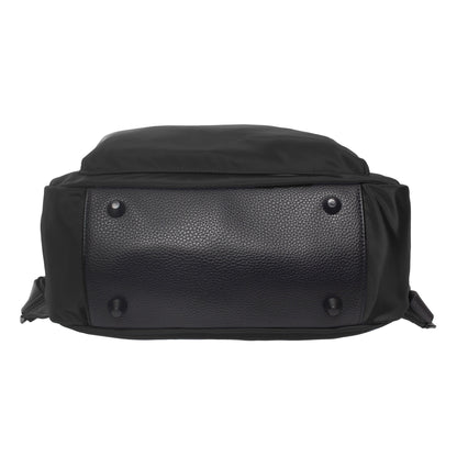 Bottom view of the SevenDays Backpack Tote showing its textured leather base and four metal studs.