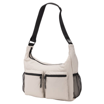 Bench Nylon Hobo Bag in beige with black adjustable strap, two front zip pockets, and mesh side pockets.