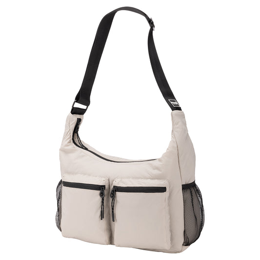Product Image – Bench Nylon Hobo Bag in beige with black adjustable strap, two front zip pockets, and mesh side pockets.