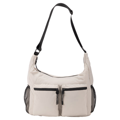 Bench Nylon Hobo Bag in light beige with two front zip pockets, mesh sides, and adjustable shoulder strap.
