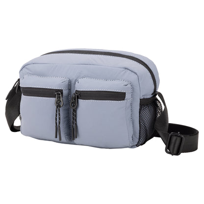 Bench Nylon Crossbody: Light blue bag with two zip pockets, mesh side pocket, and adjustable black strap.
