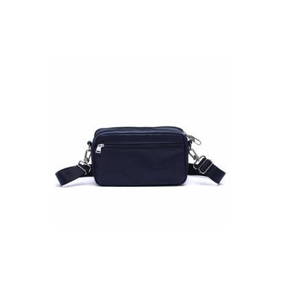 The Beside-U Gelato Crossbody is a small black rectangular bag with front zipper and adjustable strap.