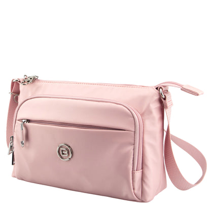 Beside-U Jubilee Crossbody in light pink with front zip pocket, silver hardware, and adjustable strap.