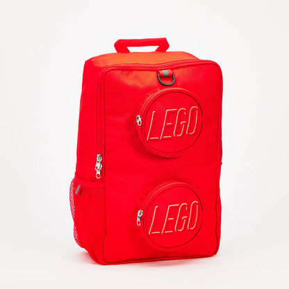Red rectangular LEGO® Brick Backpack - ONLINE ONLY with two circular zippered front pockets featuring embossed branding.
