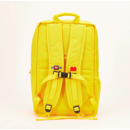 Back view of a yellow LEGO® Brick Backpack - ONLINE ONLY with adjustable straps, a chest buckle, and a mesh pocket.
