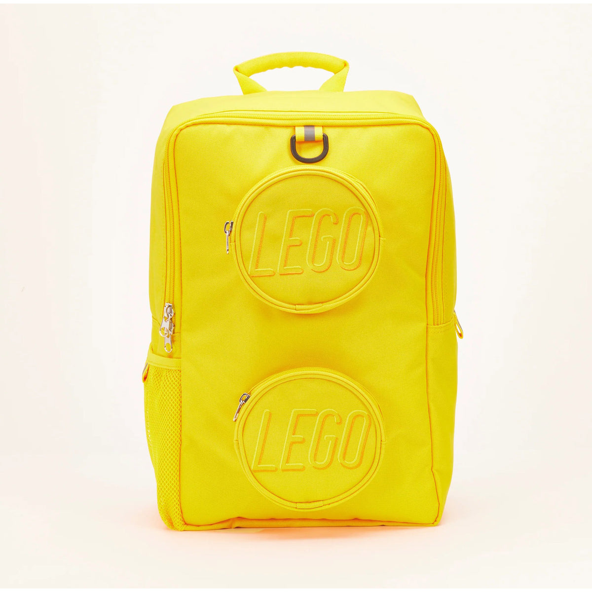 Bright yellow LEGO® Brick Backpack - ONLINE ONLY with two round, embossed front pockets resembling building bricks.