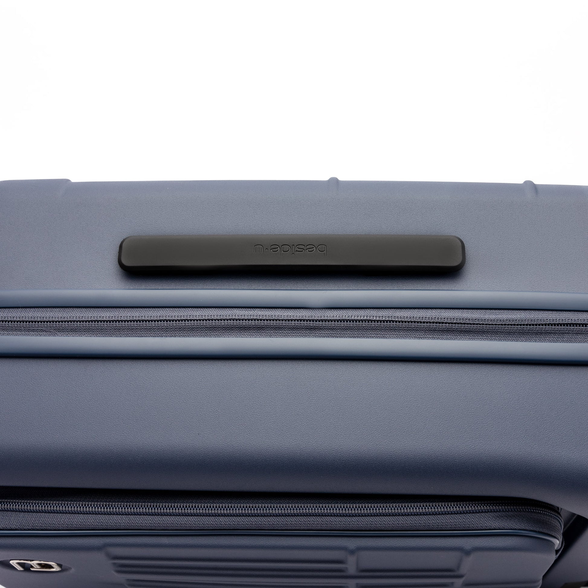 Close-up of the Beside-U Posh Voyage 20" Carry-on, a blue polycarbonate suitcase with top black handle.