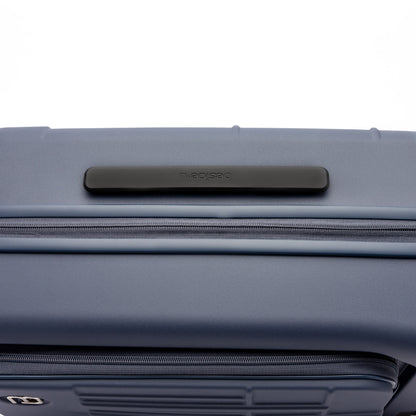 Close-up of the Beside-U Posh Voyage 20" Carry-on, a blue polycarbonate suitcase with top black handle.