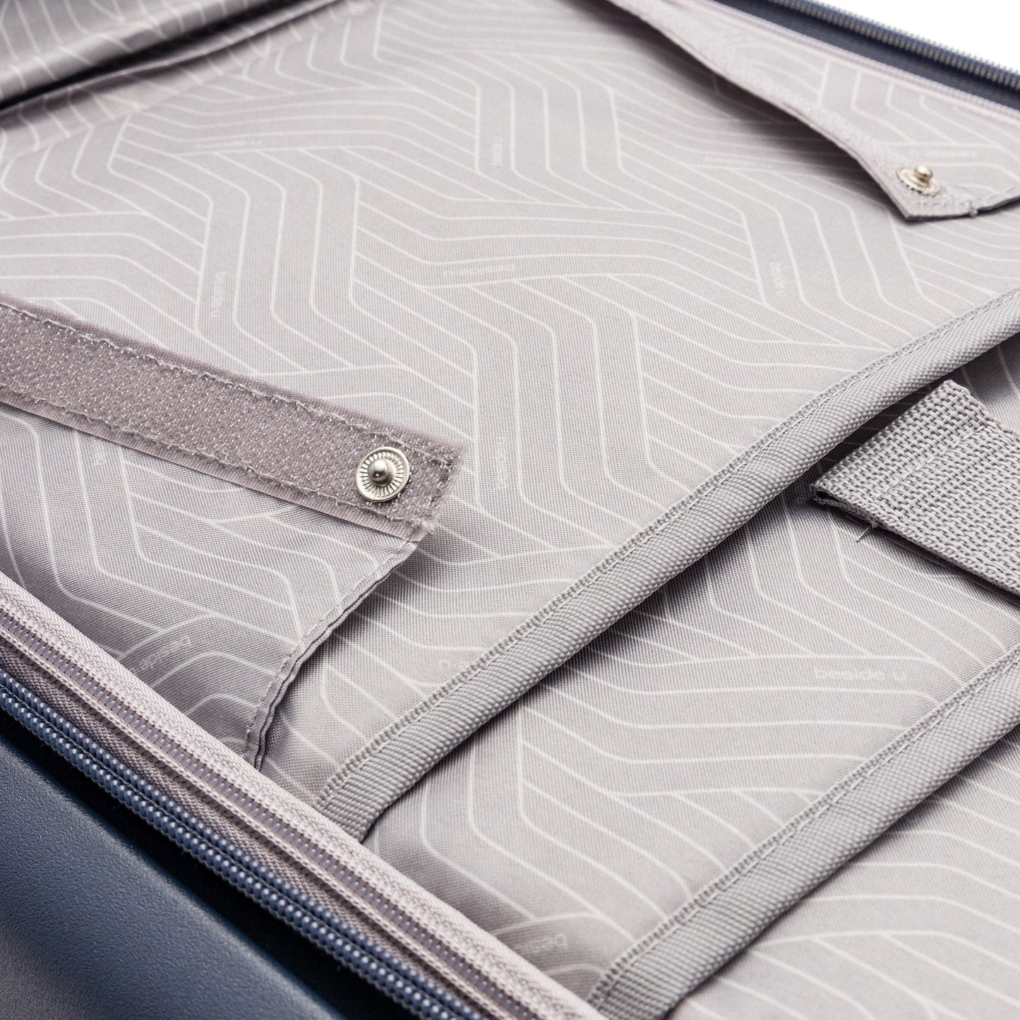 Close-up of Beside-U Posh Voyage 20" Carry-on interior with fabric lining, anti-theft zipper, and compartments.