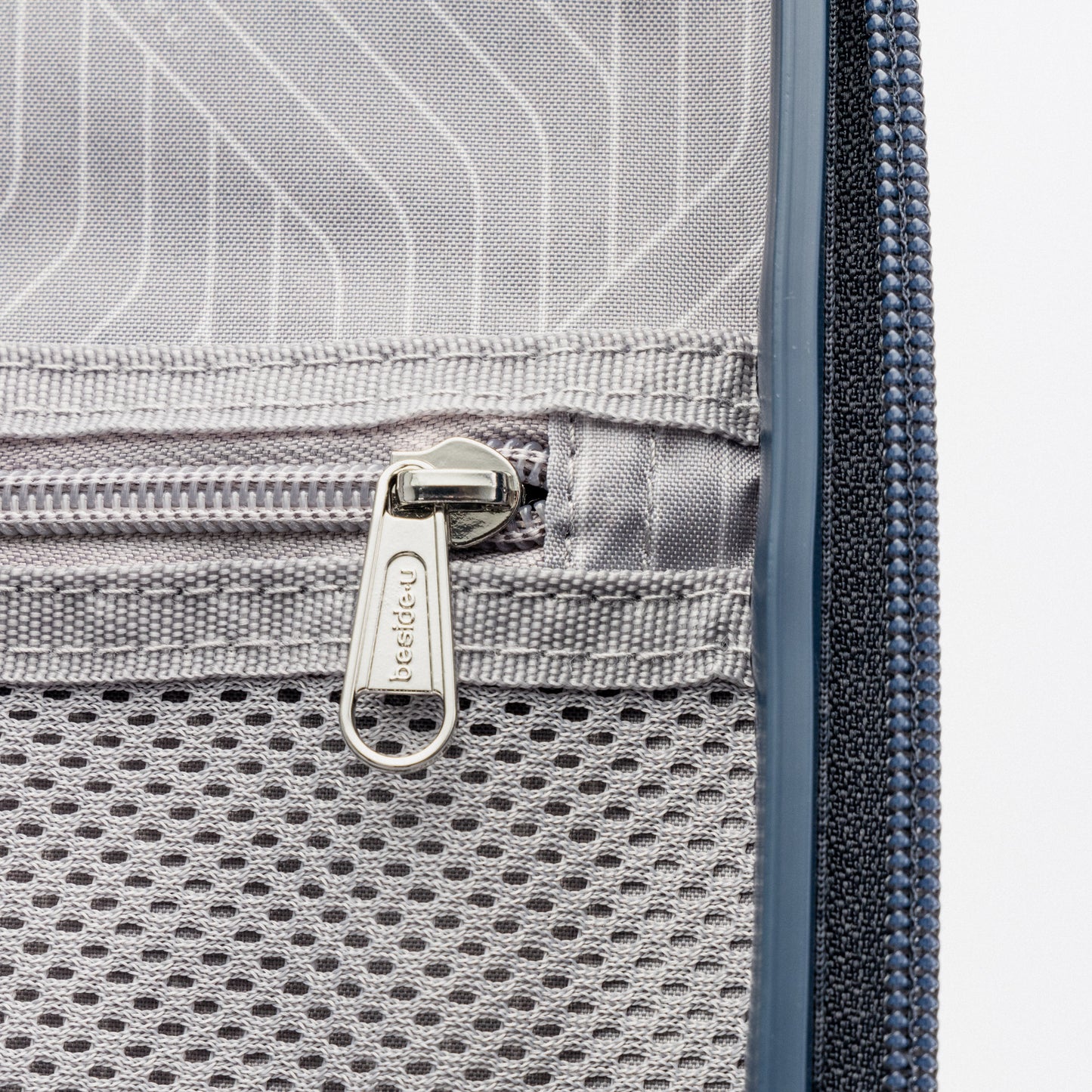 Close-up of an anti-theft zipper mesh pocket inside the Beside-U Posh Voyage 20" Carry-on bag.