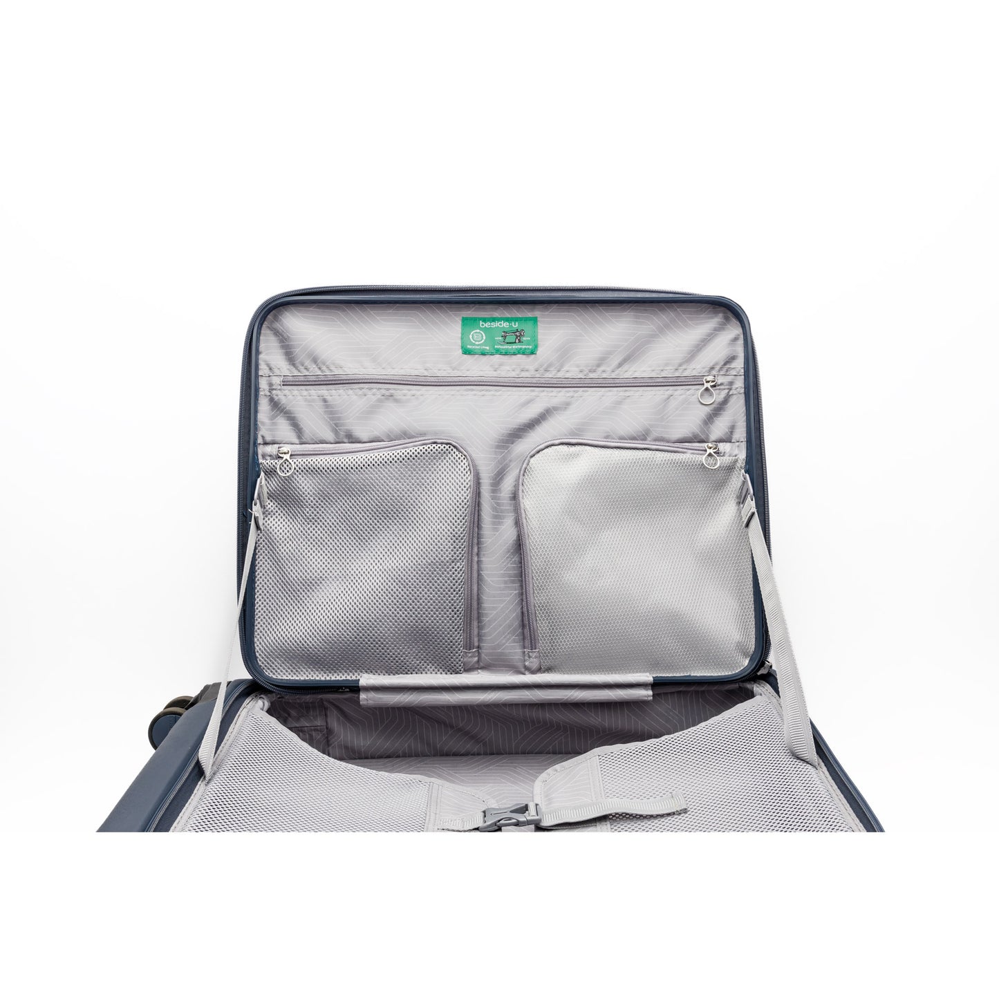 The Beside-U Posh Voyage 24" features top-loading access, interior mesh pockets, straps, and a green lid label.