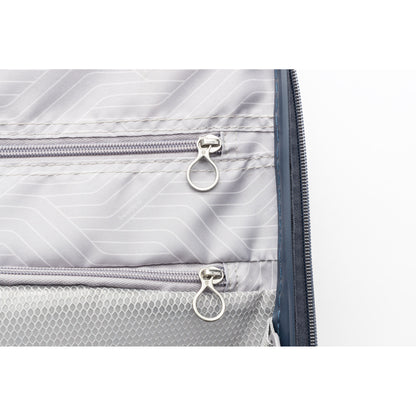 Close-up of two mesh pockets and a divider inside Beside-U Posh Voyage 24" hardside spinner luggage.
