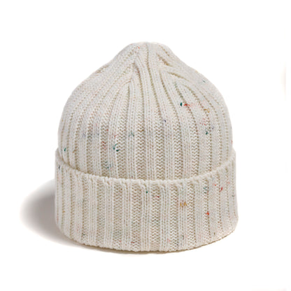 The Brume Owl's Head Hat is a cozy, unisex white beanie with subtle speckles for cold-weather style.