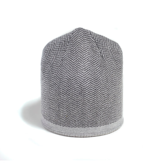 Product Image – Brume Keele Peak Hat by Brume: a gray unisex knit beanie with herringbone pattern on a white background.