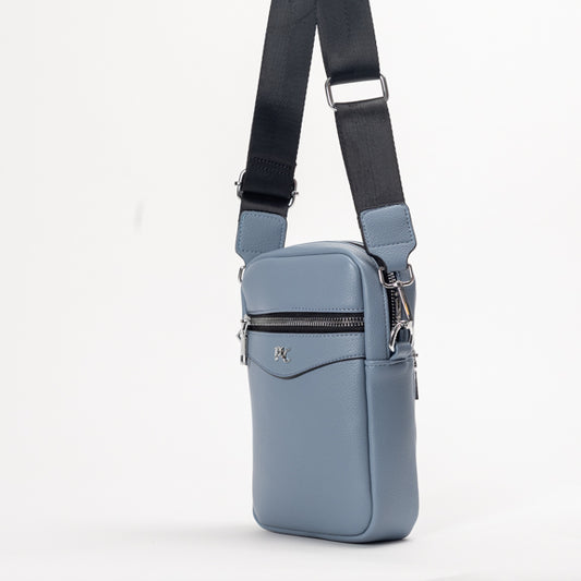 Product Image – The Miss Caprice Compact Crossbody is a small blue bag with a black adjustable strap and zipper pocket for daily use.