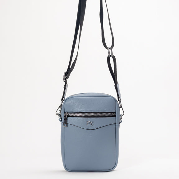 Miss Caprice Compact Crossbody: a blue leather bag with silver logo and zipper, perfect for daily use.