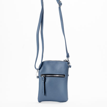The Miss Caprice Small Crossbody is a blue bag with front zipper pocket and adjustable shoulder strap.