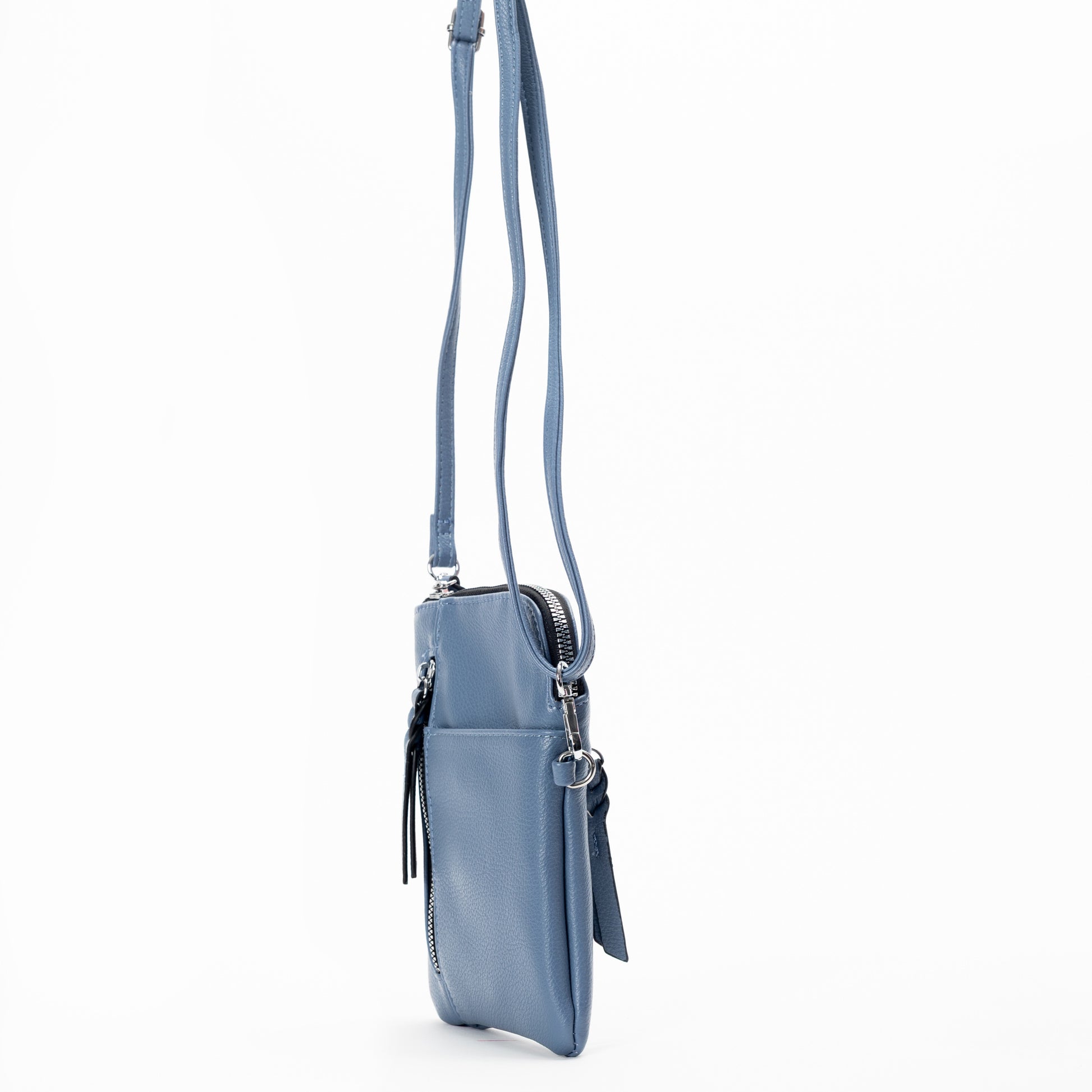 Miss Caprice Small Crossbody: light blue bag with front pocket, zipper closure, and slim straps for essentials.