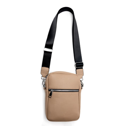 The Miss Caprice Compact Crossbody in beige with a black strap offers practical style for every day.