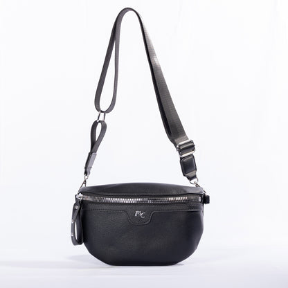 The Miss Caprice Waist/Crossbody Bag has a zip closure, silver hardware, and an adjustable nylon strap.
