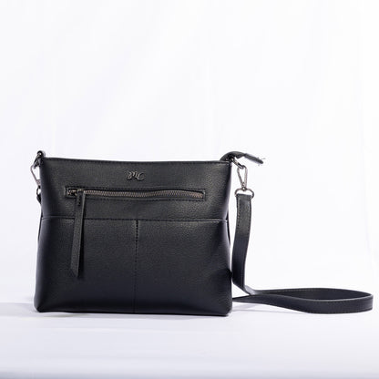 Miss Caprice Front Zipper Crossbody: black leather bag with front zip pocket and adjustable strap.