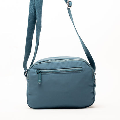 Miss Caprice Compact Nylon Crossbody in blue with front zip pocket & adjustable strap—ideal for everyday use.