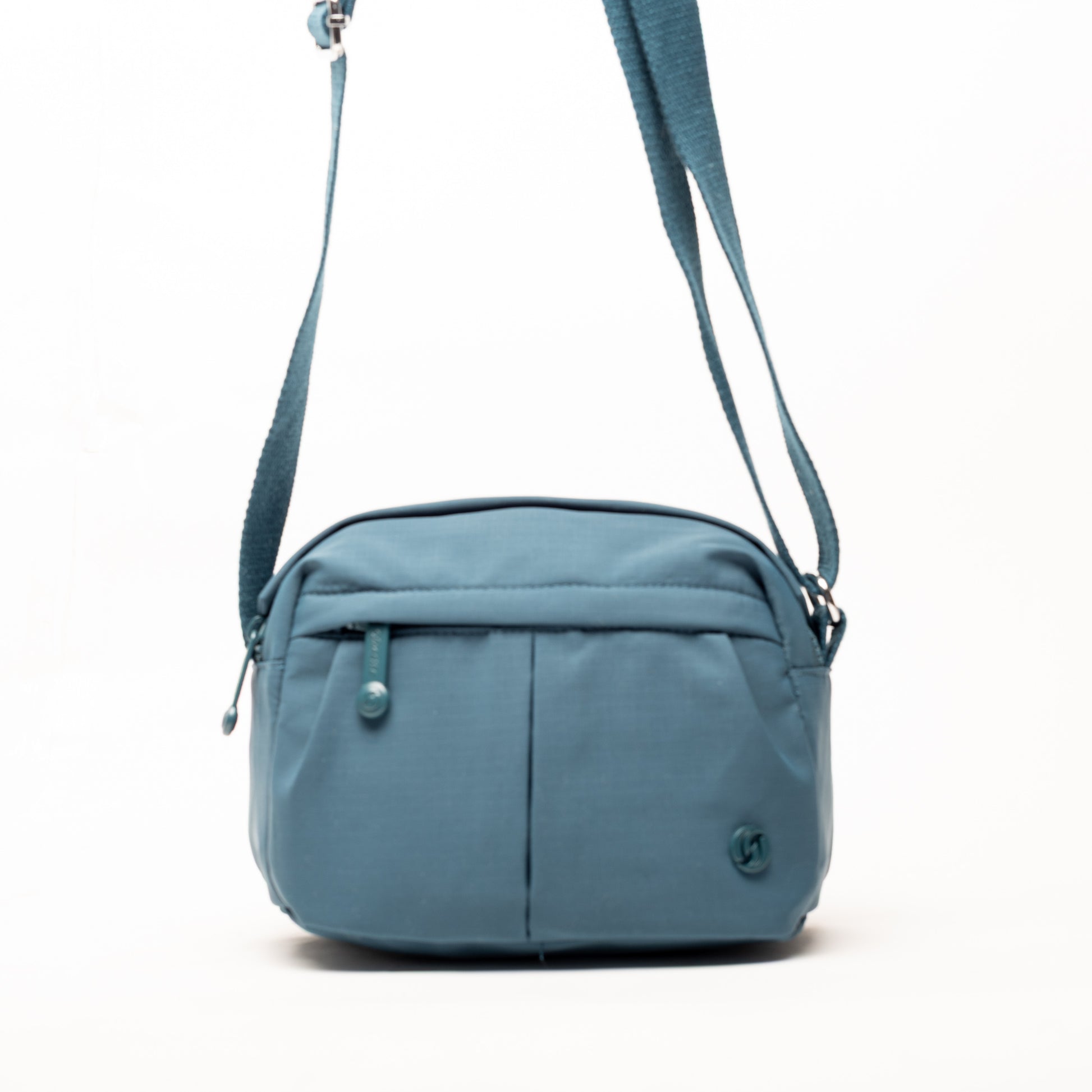 Miss Caprice Compact Nylon Crossbody: blue bag with front zipper pocket, adjustable strap—ideal for daily use.