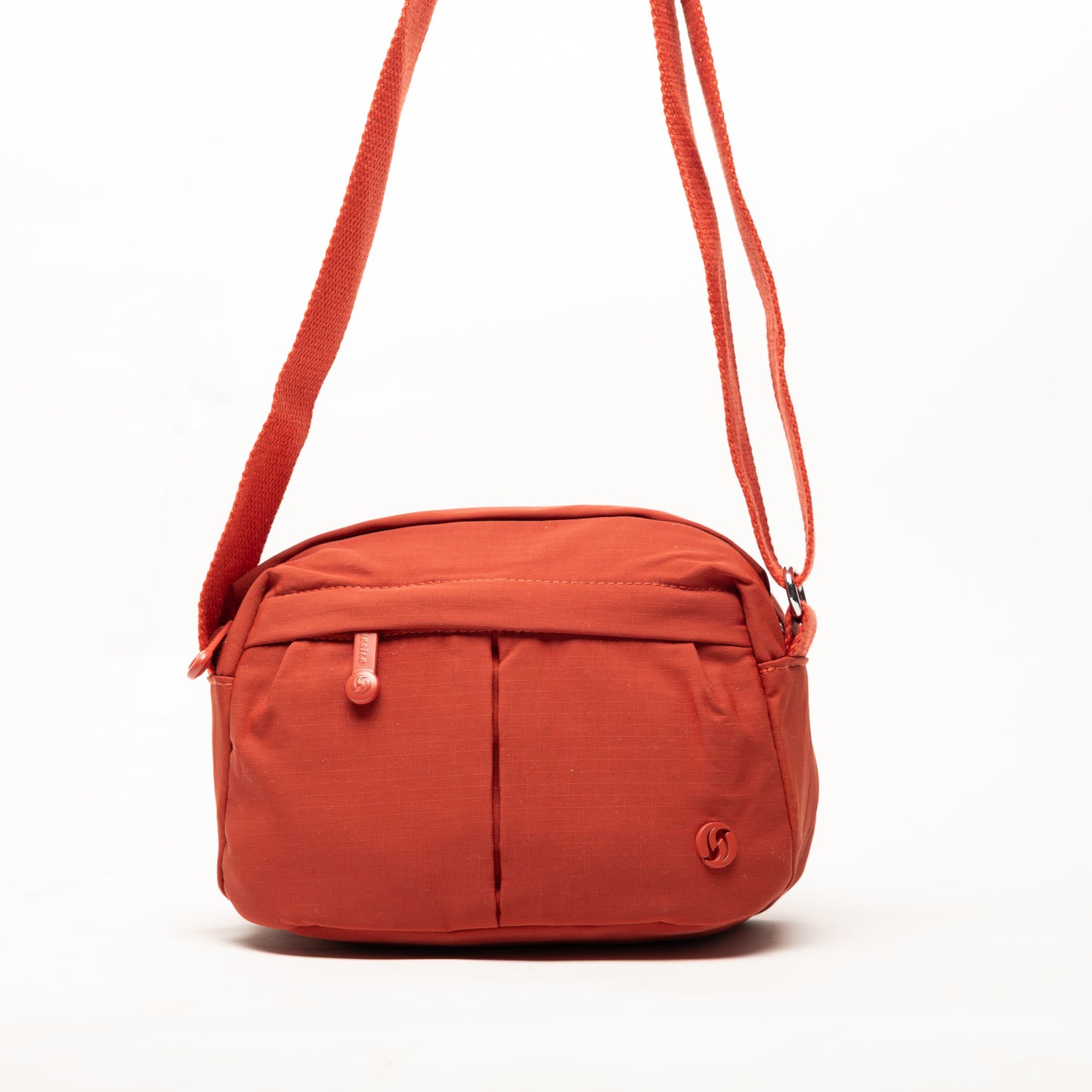 Miss Caprice Compact Nylon Crossbody in orange features two front pockets and an adjustable strap for daily use.