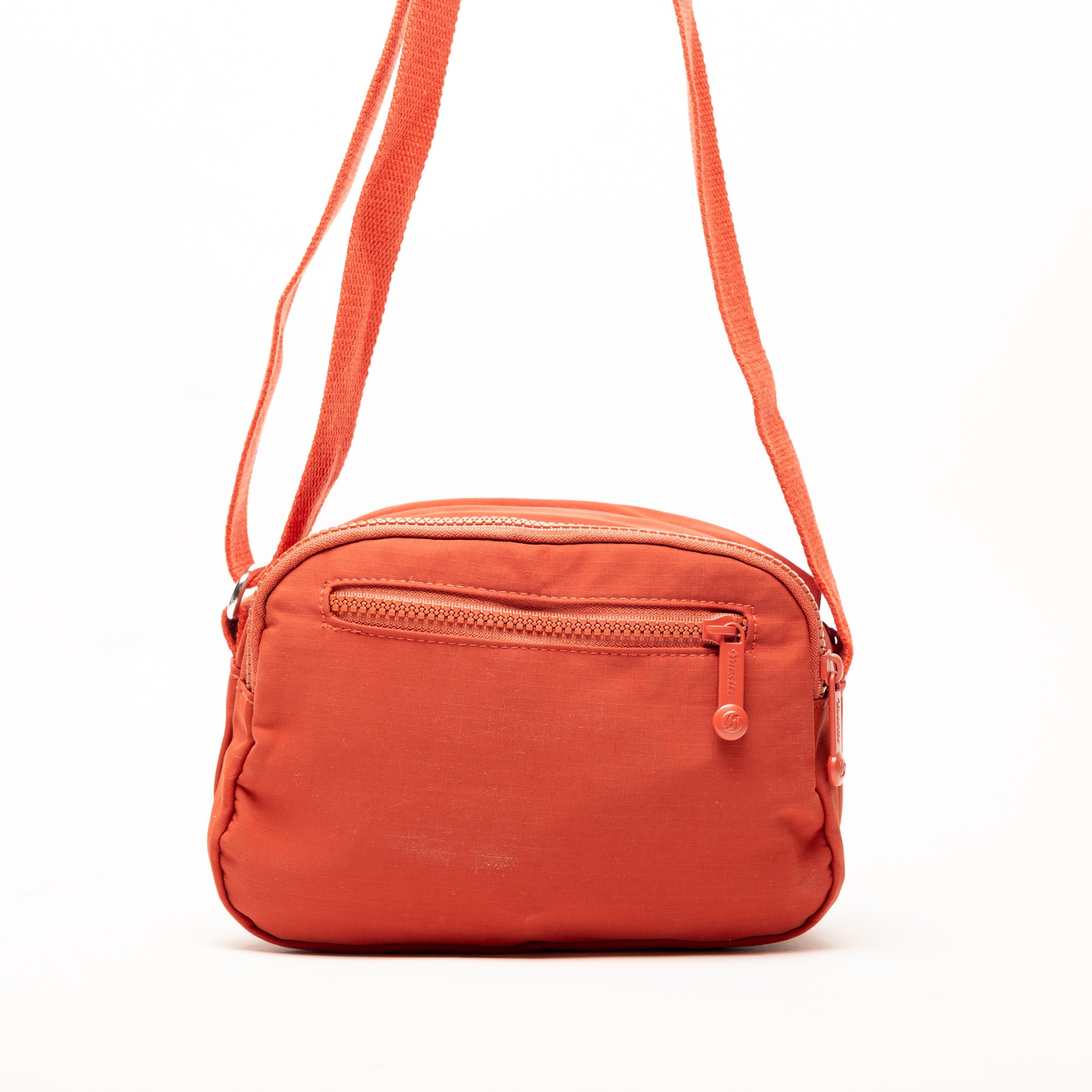 Miss Caprice Compact Nylon Crossbody: a small orange bag with front zipper pocket and adjustable strap.
