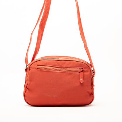 Miss Caprice Compact Nylon Crossbody: a small orange bag with front zipper pocket and adjustable strap.