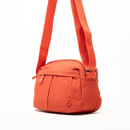 Miss Caprice Compact Nylon Crossbody features a front pocket, zipper closure, and adjustable strap for daily use.