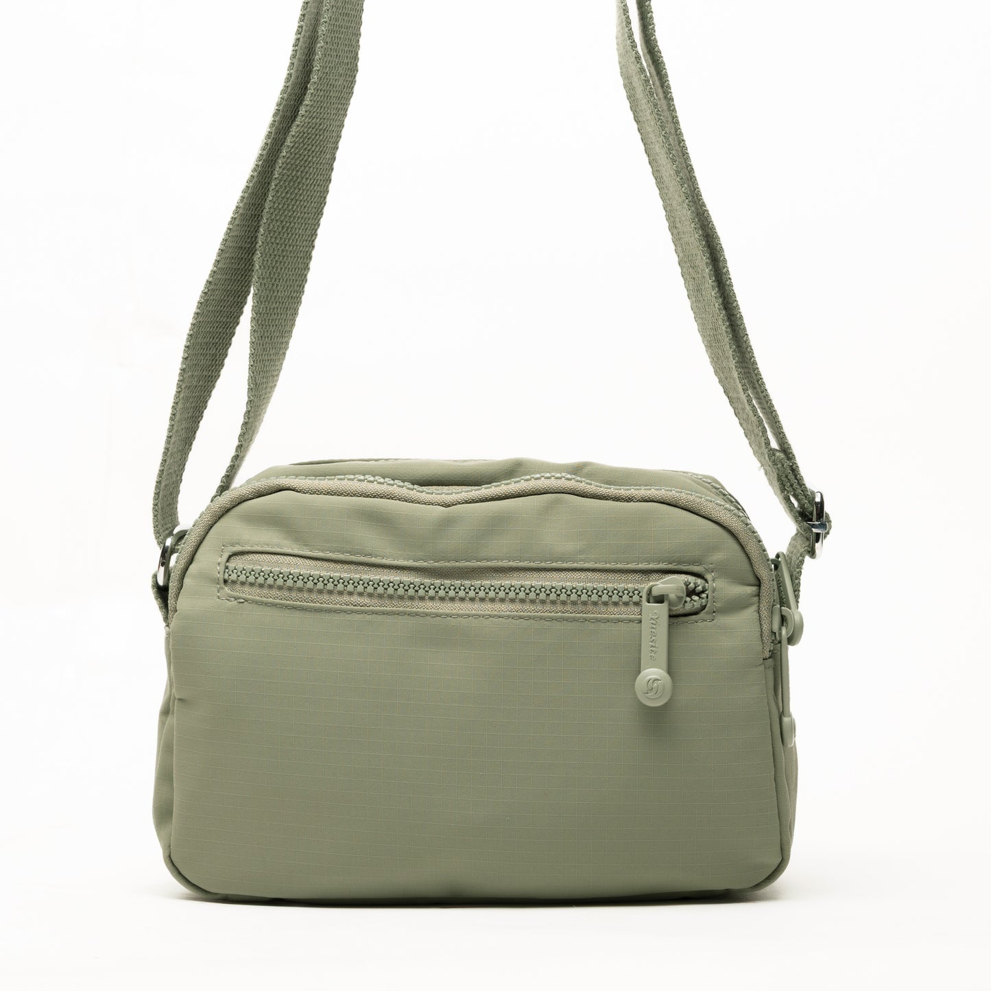 Miss Caprice Nylon Crossbody: a light green, lightweight bag with zip pocket and adjustable strap for daily use.