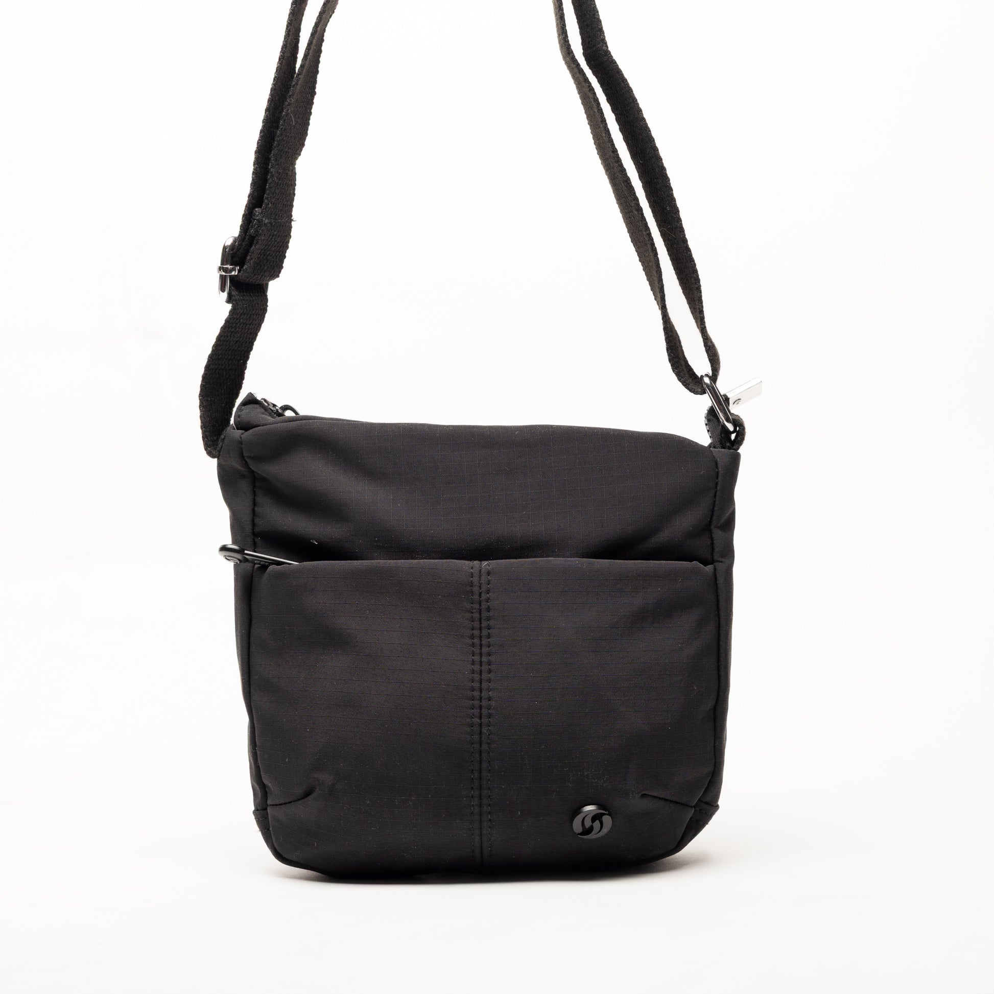 Miss Caprice Small Nylon Crossbody: black with front pocket, adjustable strap, small logo—ideal for travel.