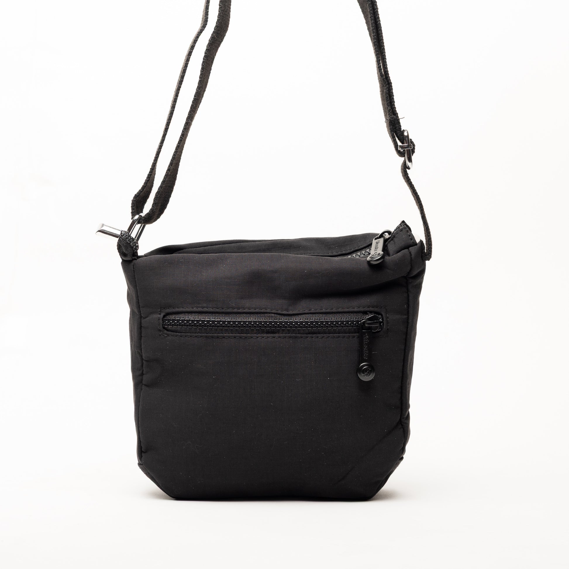 Miss Caprice Small Nylon Crossbody in black with front zip pocket and adjustable strap, on white background.