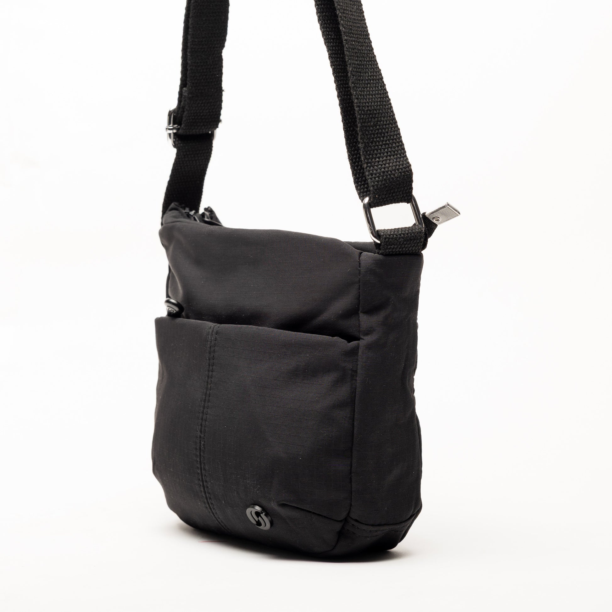 Miss Caprice Small Nylon Crossbody bag with adjustable strap and front pocket, shown on white background.
