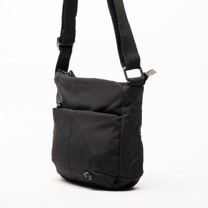 Miss Caprice Small Nylon Crossbody bag with adjustable strap and front pocket, shown on white background.