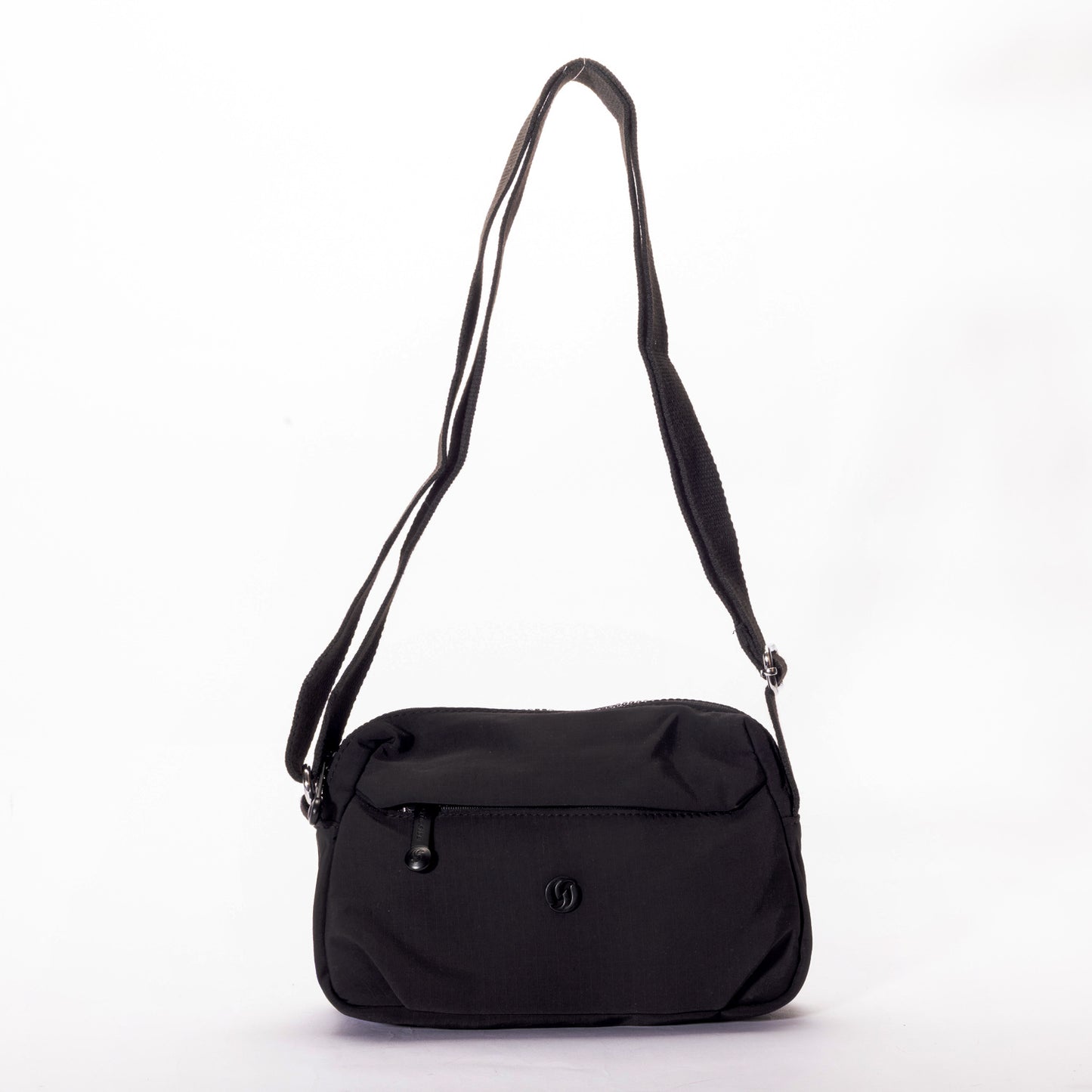 The Miss Caprice Nylon Crossbody is a lightweight bag with a front zip pocket—ideal for travel or daily use.