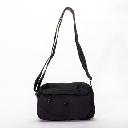 The Miss Caprice Nylon Crossbody is a lightweight bag with a front zip pocket—ideal for travel or daily use.