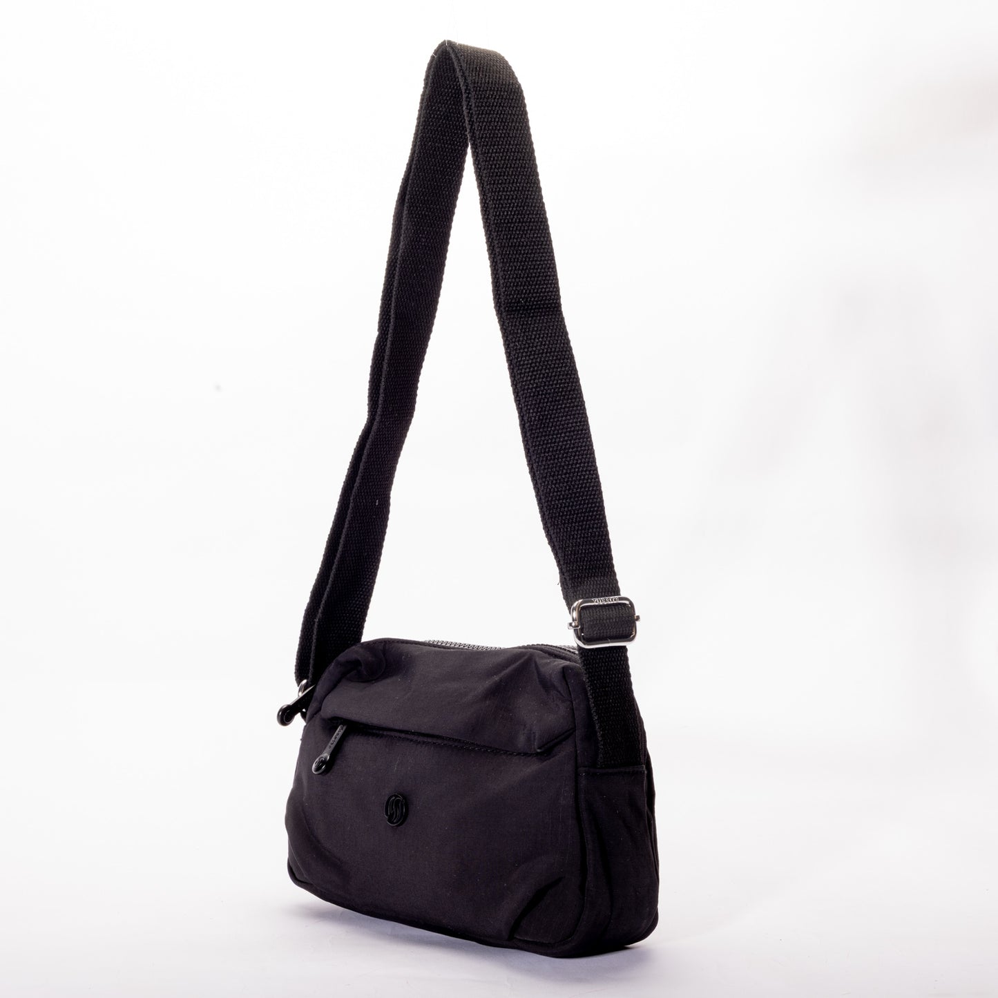 The Miss Caprice Nylon Crossbody is a lightweight bag with a zip pocket and adjustable strap for daily use.
