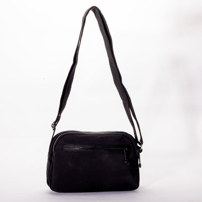 The Miss Caprice Nylon Crossbody is a lightweight bag with zip pocket and adjustable strap—ideal for daily use or travel.