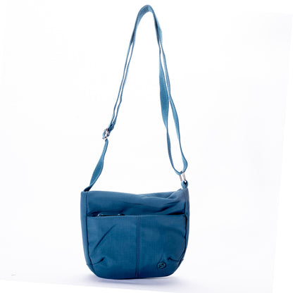 Miss Caprice Small Nylon Crossbody in blue, with front zipper pocket and adjustable strap on white background.