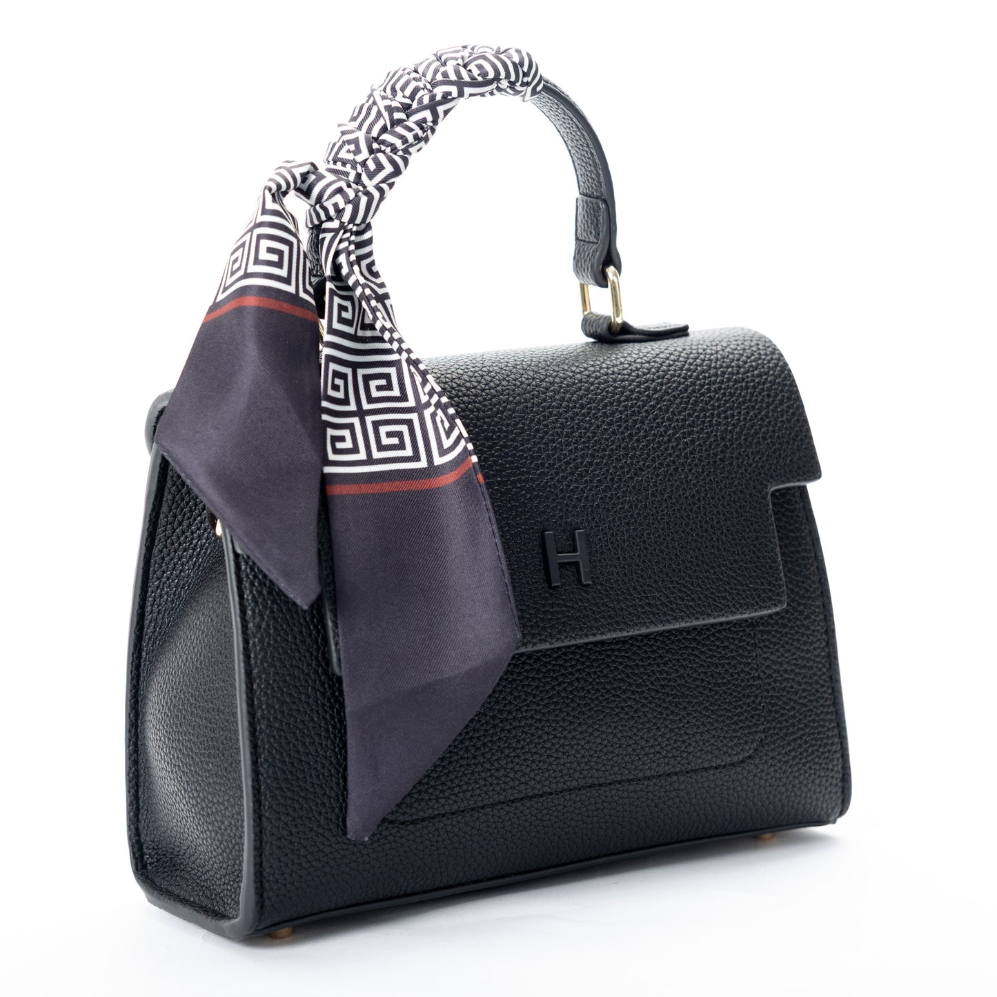 Miss Caprice Hope Handbag: Black faux leather with top handle, styled with a black and white patterned scarf.