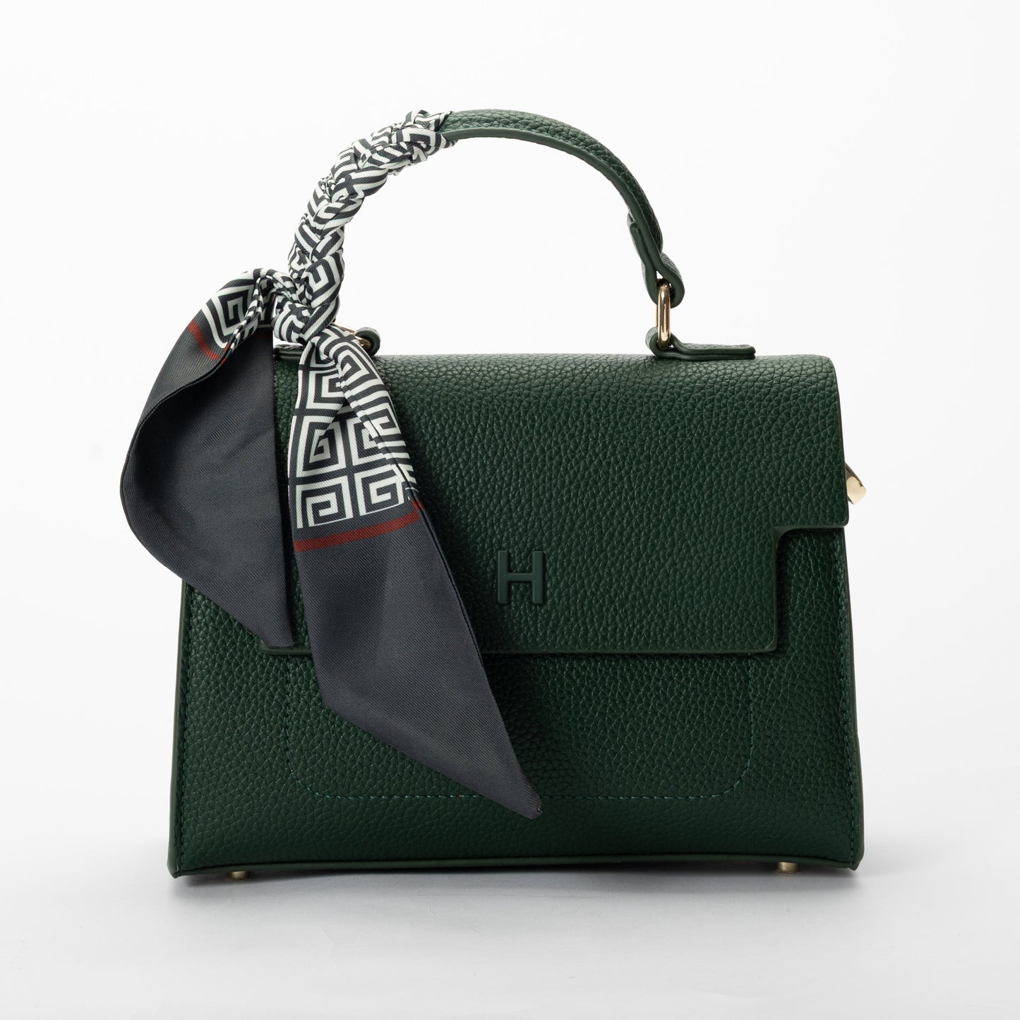 Miss Caprice Hope Handbag in dark green faux leather, styled with a black-and-white scarf for added flair.