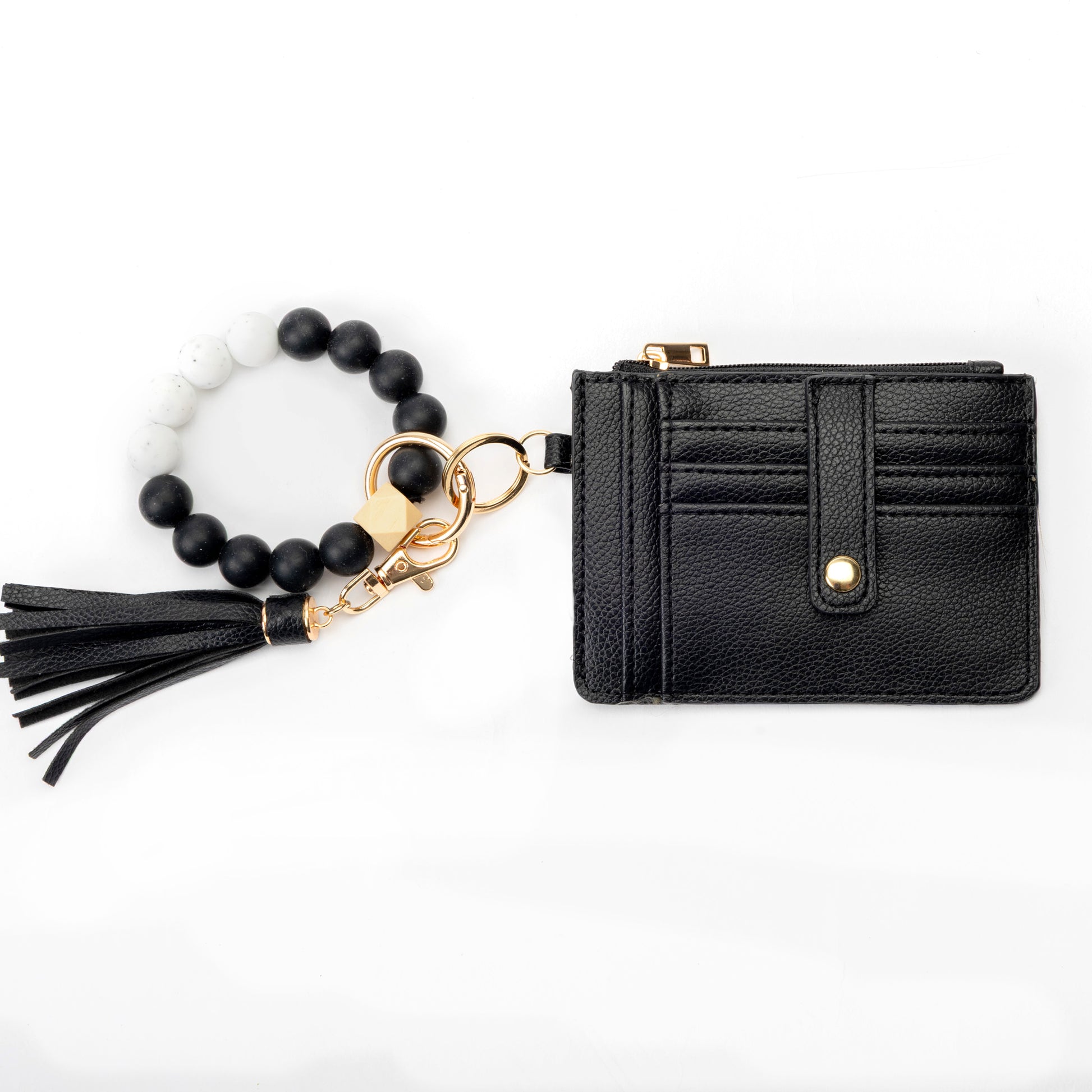 Miss Caprice Cardholder with bracelet keychain and gold zipper, in black faux leather with tassel detail.