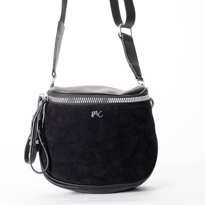 Miss Caprice Clara Crossbody: black faux suede with silver zipper, leather strap, and front "MC" logo.