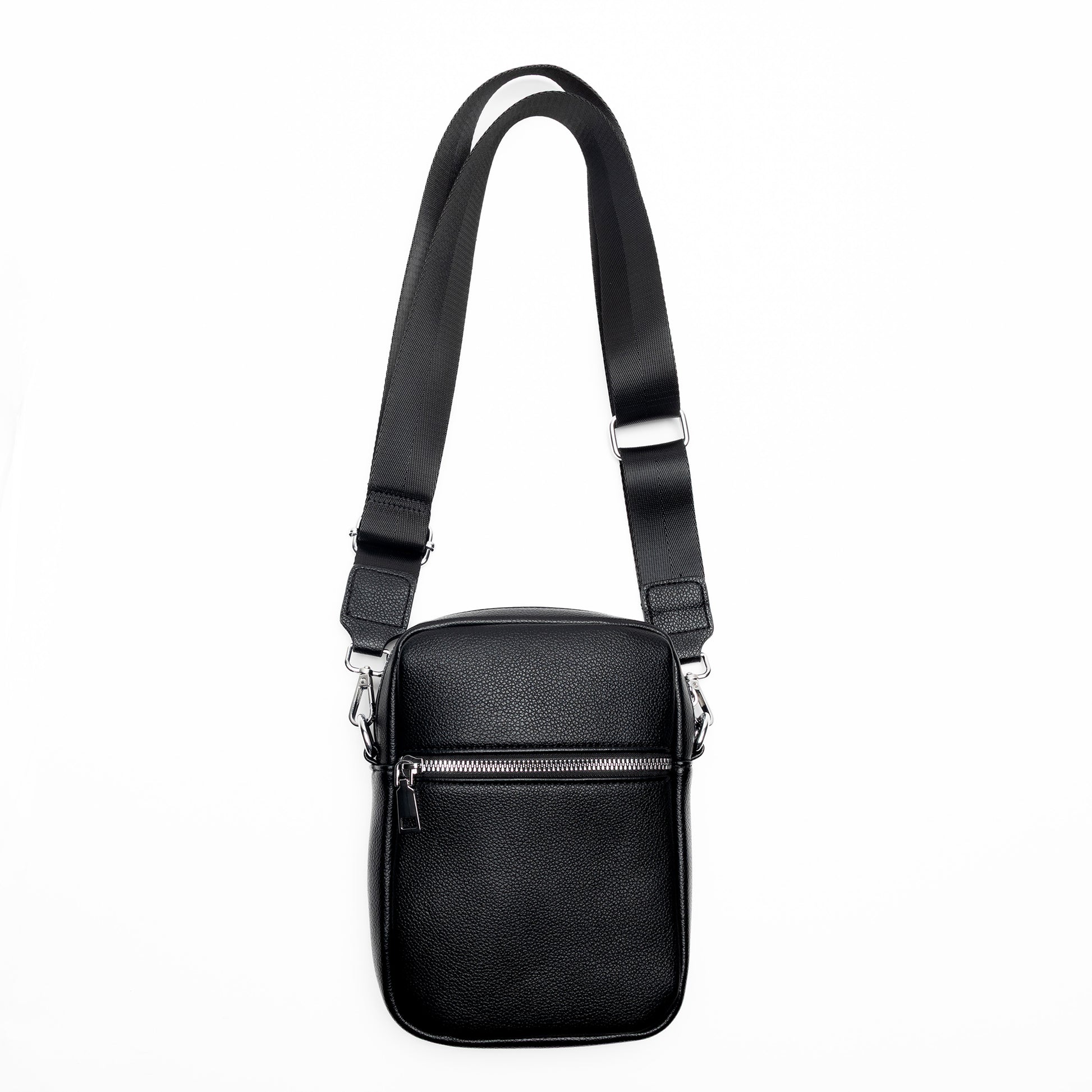Miss Caprice Compact Crossbody: a black leather bag with front zip pocket and adjustable strap for travel.